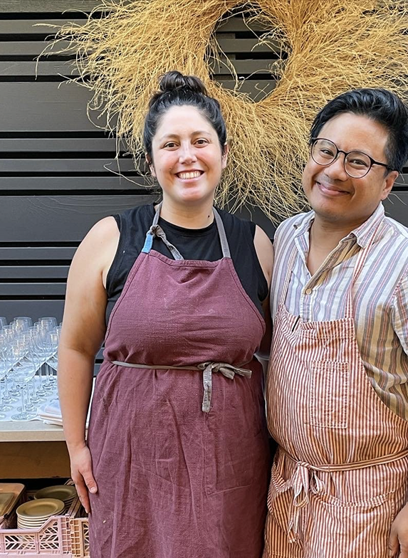 Chef Nico smiling for a photo wearing a kitchen apron